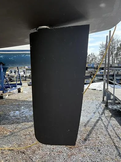 Slide: The Image of Rudder of a 2018 Beneteau 45 sailboat in a boatyard setting. - 24