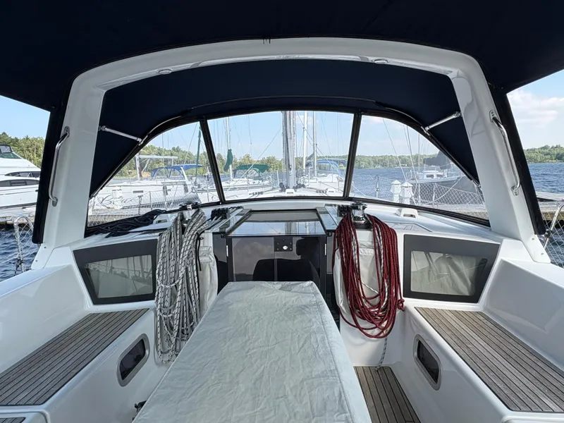 Slide: The Image of 2018 Beneteau Oceanis 45 yacht cockpit with ropes and seating, docked at marina. - 6