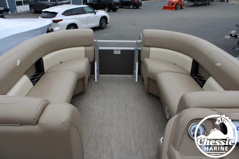 Slide: The Image of 2022 Starcraft LX 22 R pontoon boat with beige seating and spacious deck. - 10