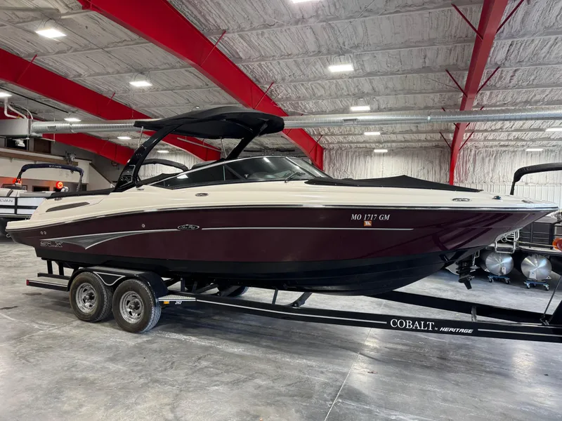 Slide: The Image of 2011 Sea Ray 250 SLX boat on trailer in indoor storage facility. - 10