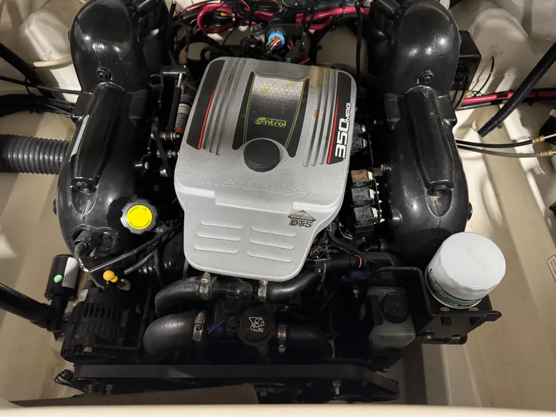 Slide: The Image of Engine of a 2011 Sea Ray 250 SLX boat, featuring a 350 MAG motor. - 12