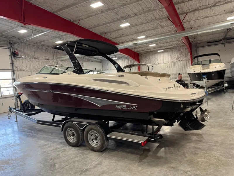 Slide: The Image of 2011 Sea Ray 250 SLX boat on trailer in indoor showroom. - 3