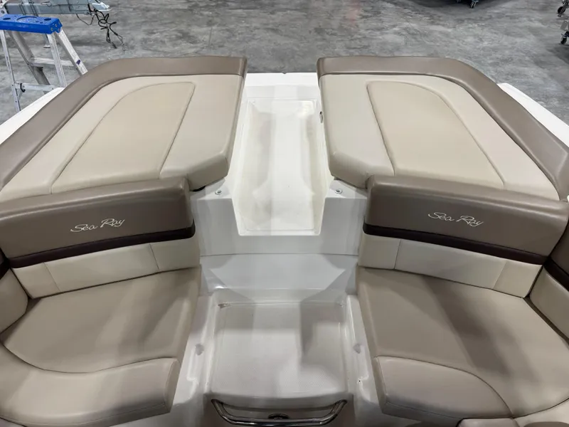 Slide: The Image of 2011 Sea Ray 250 SLX boat interior with beige seating and sleek design. - 6