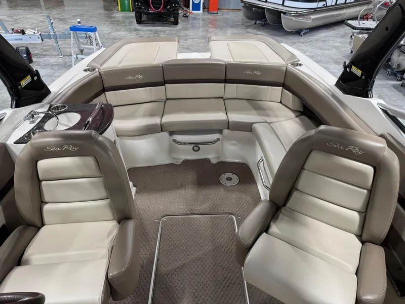 Slide: The Image of Interior of a 2011 Sea Ray 250 SLX boat with beige seating. - 8