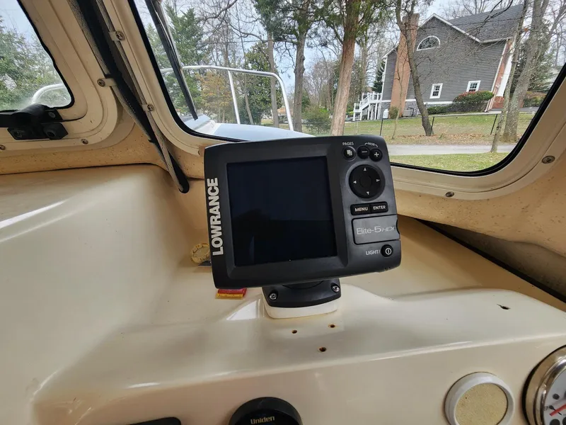 Slide: The Image of Lowrance Elite-5 sonar on 2006 C-Dory 22 Cruiser dashboard, near residential area. - 18