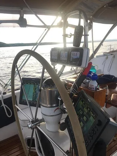 Slide: The Image of Cockpit of 1989 Catalina 42 MkII sailboat with navigation instruments and steering wheel. - 9