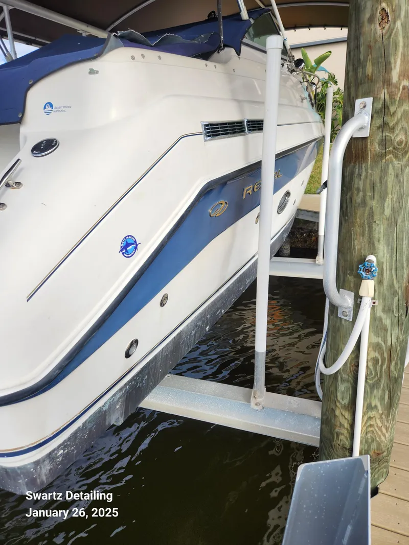 Slide: The Image of 1997 Regal 258 Commodore boat on lift, Swartz Detailing, January 26, 2025. - 14