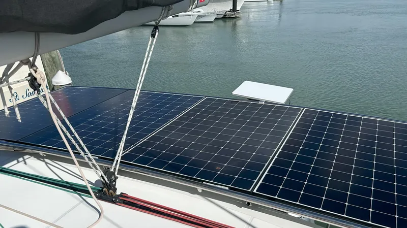 Slide: The Image of Solar panels on a 2020 Lagoon 40 catamaran, docked by the water. - 9