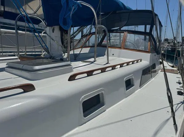 Slide: The Image of 1989 Custom SEA MAID sailboat deck with blue sail cover and sleek design. - 30