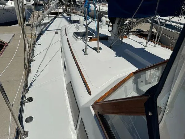 Slide: The Image of Sailboat deck view of 1989 Custom SEA MAID, docked in a marina. - 34