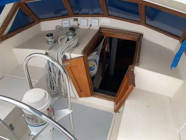 Slide: The Image of Interior of 1989 Custom SEA MAID boat with open hatch and coiled ropes. - 6