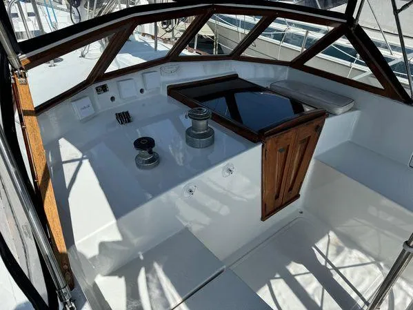 Slide: The Image of Cockpit of 1989 Custom SEA MAID boat with wooden accents and winches. - 10