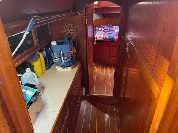 Slide: The Image of Nautical interior of 1989 Custom SEA MAID with wooden cabinetry and cozy sleeping area. - 22