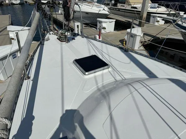 Slide: The Image of Sailboat deck view of 1989 Custom SEA MAID, docked at marina. - 28