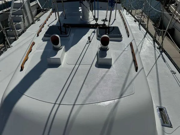 Slide: The Image of Deck of 1989 Custom SEA MAID yacht with sleek design and wooden accents. - 29