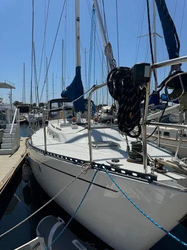 Slide: The Image of 1989 Custom SEA MAID sailboat docked at marina, surrounded by other boats. - 35