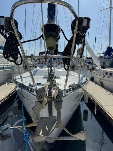 Slide: The Image of Sailboat "SEA MAID" 1989 model docked at marina, front view with anchors. - 36