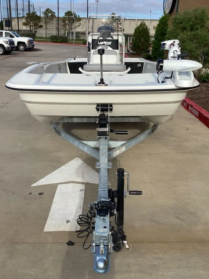 Slide: The Image of 2025 Mako Pro Skiff 17 CC boat on trailer, parked outdoors. - 3