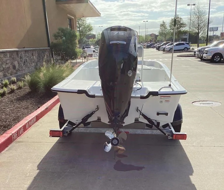 Slide: The Image of 2025 Mako Pro Skiff 17 CC boat on trailer, parked outdoors. - 5
