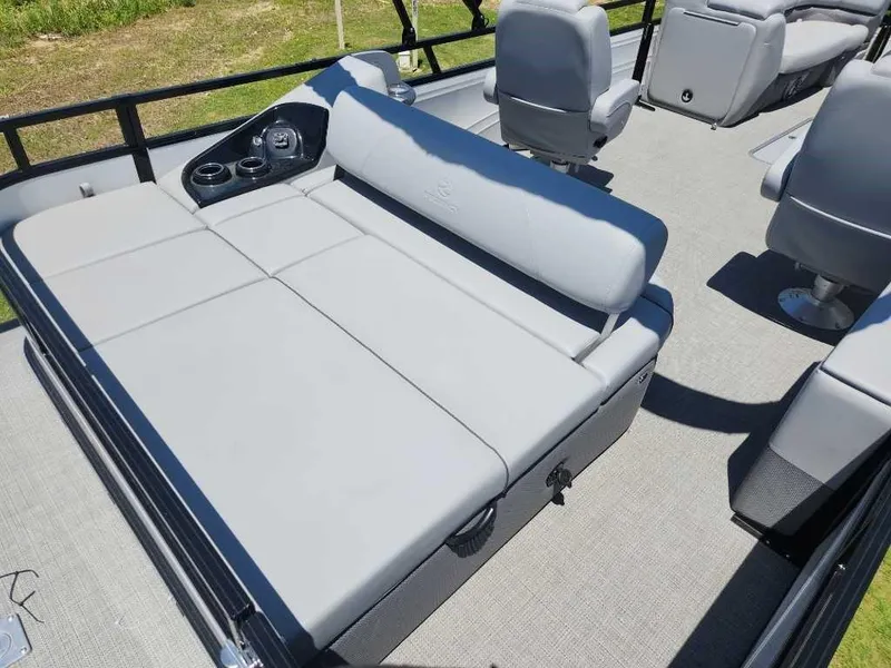 Slide: The Image of 2024 Regency 250 DL3 boat interior with gray seating and cup holders. - 8