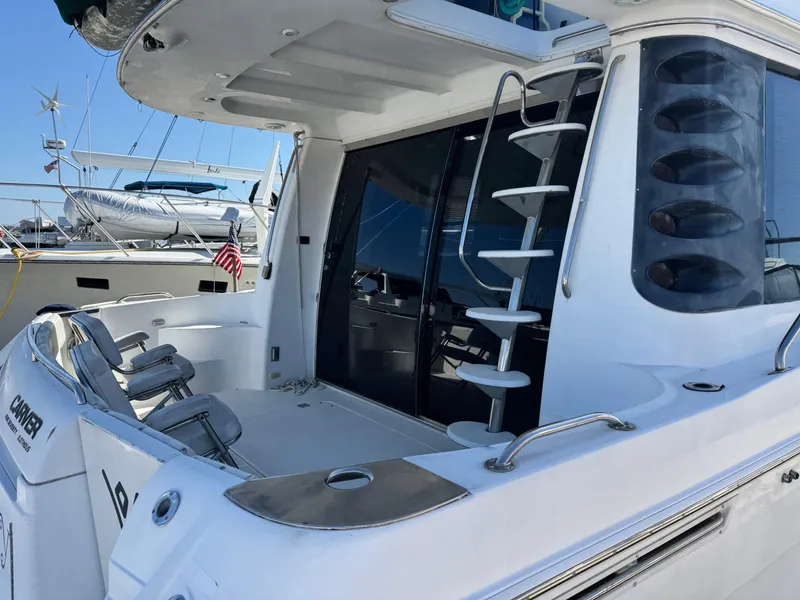 Slide: The Image of 2002 Carver 570 Voyager Pilothouse yacht with sleek design and modern amenities. - 11