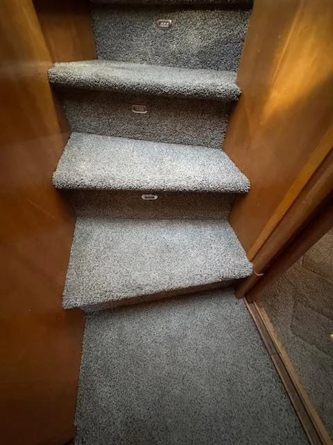 Slide: The Image of Carpeted stairs inside 2002 Carver 570 Voyager Pilothouse yacht. - 31