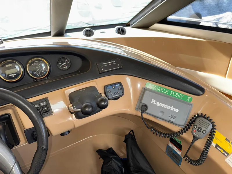 Slide: The Image of Interior view of 2002 Carver 570 Voyager Pilothouse dashboard with Raymarine equipment. - 18