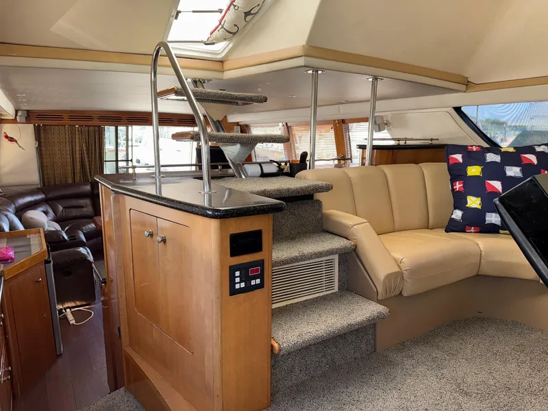 Slide: The Image of Luxurious interior of 2002 Carver 570 Voyager Pilothouse with plush seating and modern design. - 21