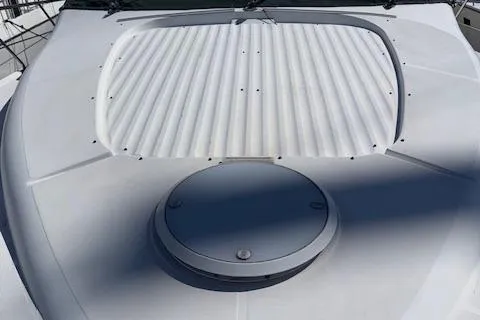 Slide: The Image of 2002 Carver 570 Voyager Pilothouse deck with hatch and ribbed cover. - 40