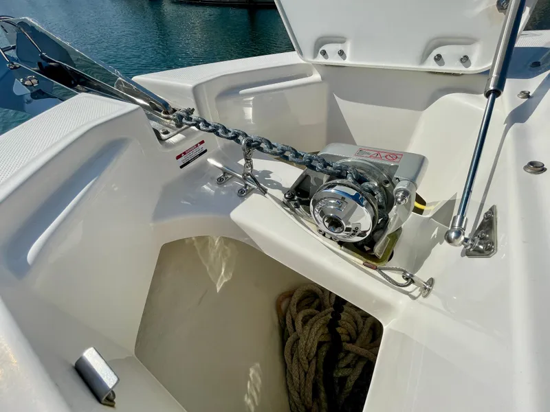 Slide: The Image of 2021 Robalo 247 Dual Console anchor compartment with chain and rope storage. - 18