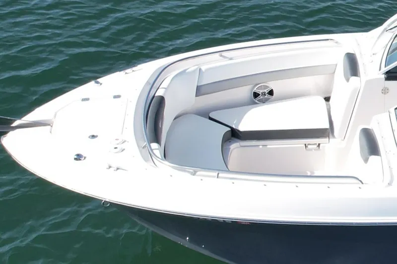 Slide: The Image of 2021 Robalo 247 Dual Console boat, white seating, on calm water. - 3