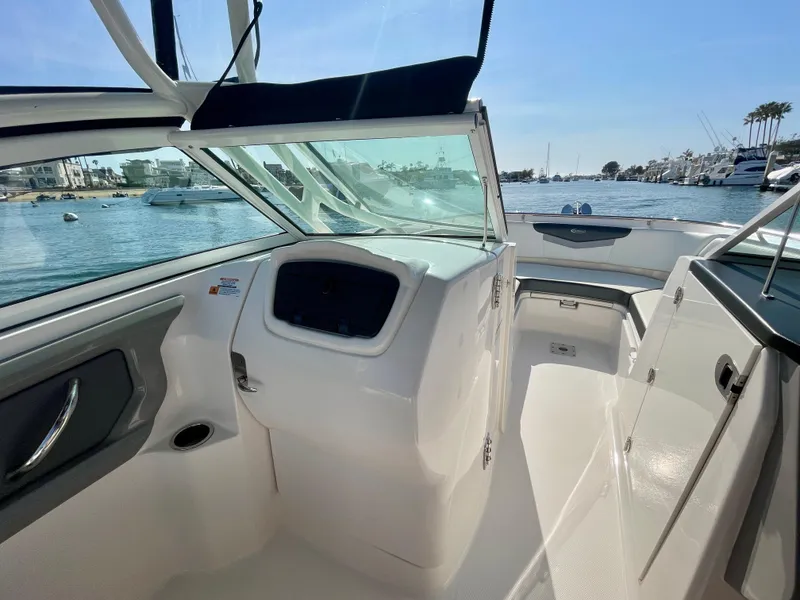 Slide: The Image of 2021 Robalo 247 Dual Console boat interior with open water view. - 9