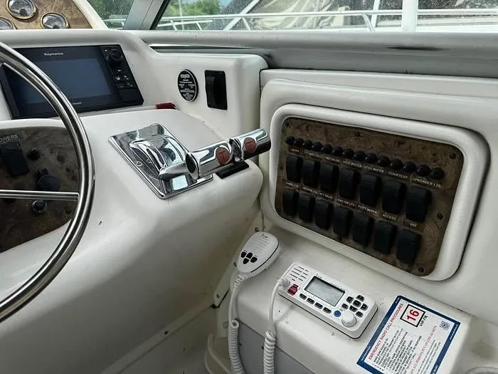 Slide: The Image of Control panel of a 2000 Wellcraft 3200 boat with navigation and communication equipment. - 10