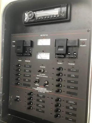 Slide: The Image of Electrical control panel on a 2000 Wellcraft 3200 boat with stereo system. - 11