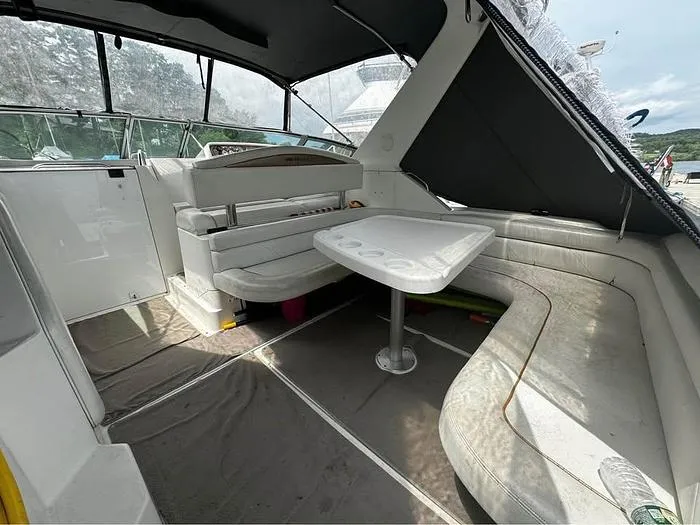 Slide: The Image of Interior of 2000 Wellcraft 3200 boat with seating and table setup. - 16