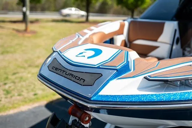 Slide: The Image of 2022 Centurion Ri265 boat, close-up of bow with sleek design and logo. - 4