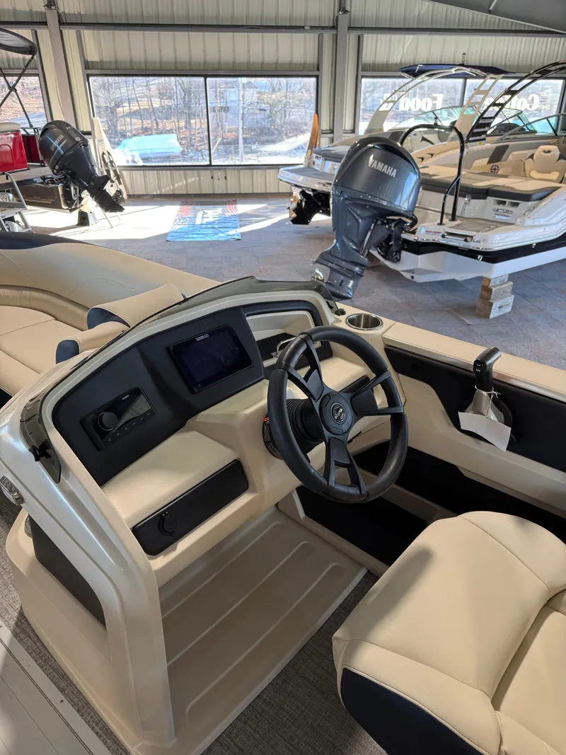 Slide: The Image of 2025 Tahoe Pontoon LTZ Versatile Rear Bench with modern helm and comfortable seating. - 10