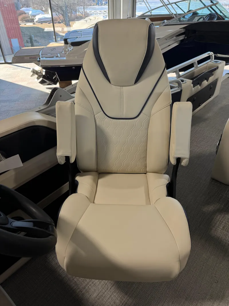 Slide: The Image of 2025 Tahoe Pontoon LTZ Versatile Rear Bench seat, beige upholstery, armrests, modern design. - 9