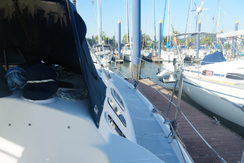 Slide: The Image of Sailboat docked at marina, Hunter 410 model, 1998, with ropes and equipment visible. - 15
