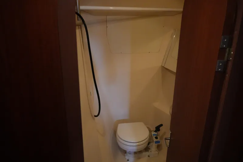 Slide: The Image of Compact bathroom in 1998 Hunter 410 sailboat with toilet and shower. - 21
