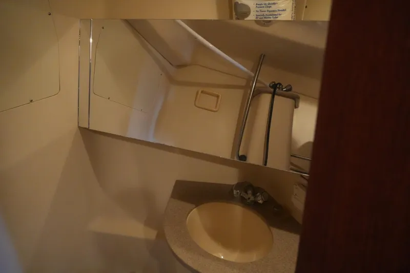 Slide: The Image of Bathroom interior of 1998 Hunter 410 sailboat with sink and mirror. - 22
