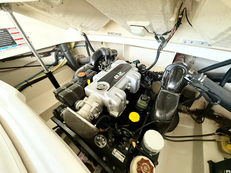 Slide: The Image of Engine compartment of a 2010 Sea Ray 250 SLX boat, showcasing detailed components. - 18