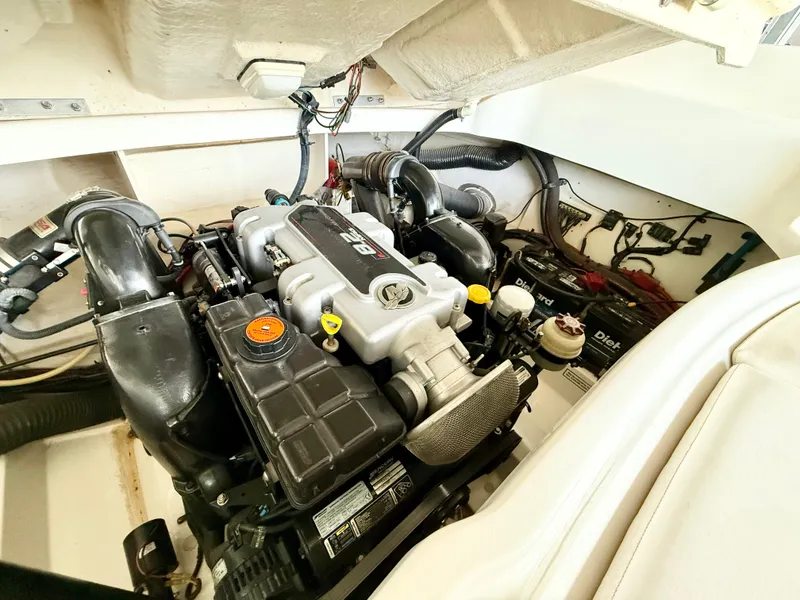Slide: The Image of Engine compartment of a 2010 Sea Ray 250 SLX boat, showcasing detailed mechanical components. - 19
