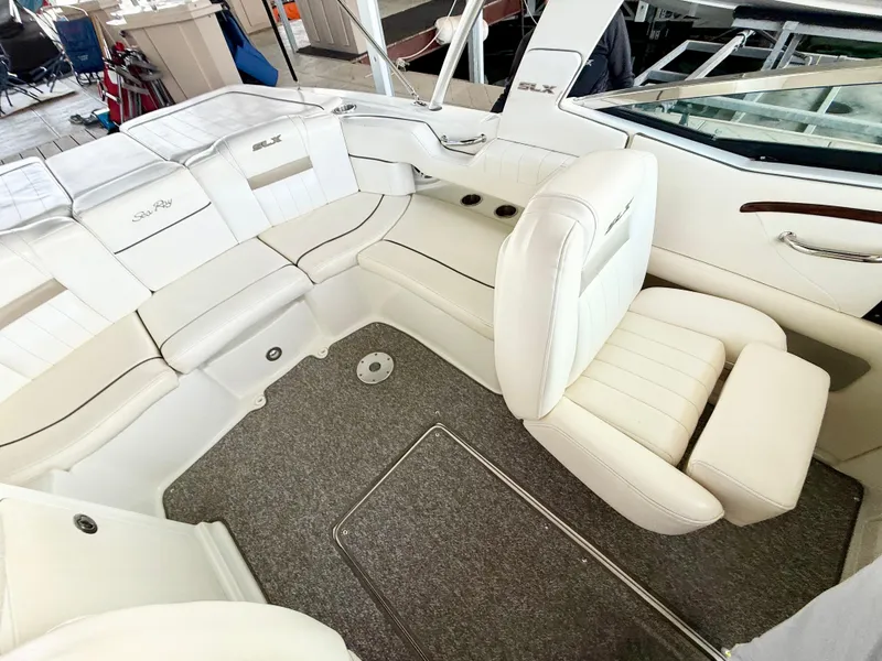 Slide: The Image of Luxurious interior of a 2010 Sea Ray 250 SLX boat with white seating. - 7