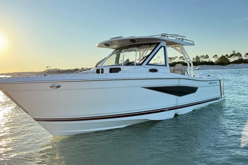 The Image of 2025 Solara S-310 CW boat on calm water at sunset. - 0
