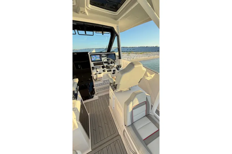 Slide: The Image of Interior view of 2025 Solara S-310 CW boat cockpit with modern controls and seating. - 10