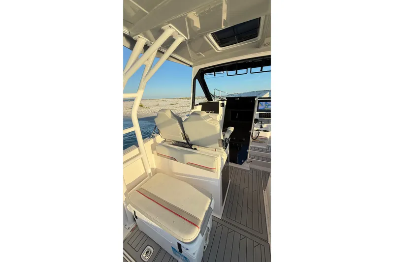 Slide: The Image of Interior of 2025 Solara S-310 CW boat with modern seating and navigation equipment. - 11