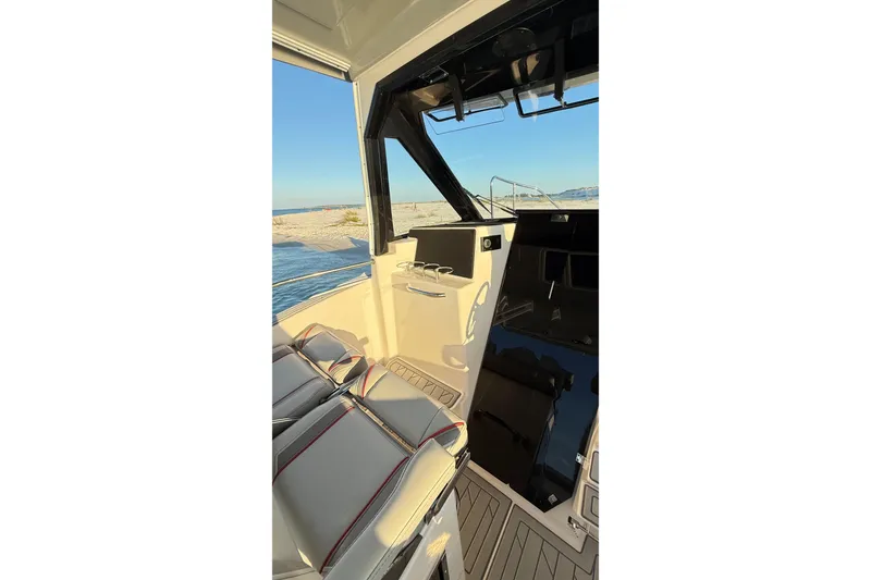 Slide: The Image of Interior view of 2025 Solara S-310 CW boat, featuring sleek seating and modern design. - 12