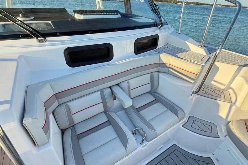 Slide: The Image of Luxurious seating area on 2025 Solara S-310 CW boat, featuring modern design and waterfront view. - 19
