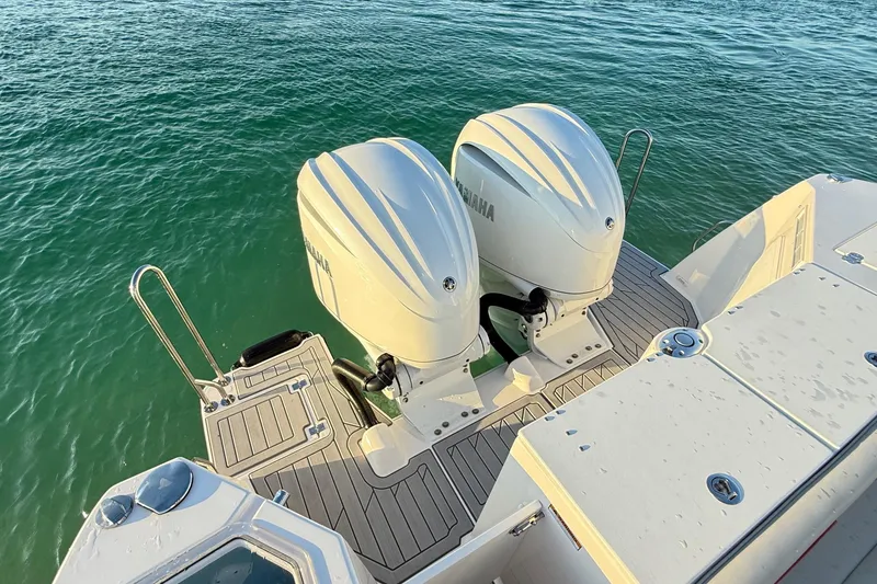 Slide: The Image of 2025 Solara S-310 CW boat with dual Yamaha outboard engines on water. - 4